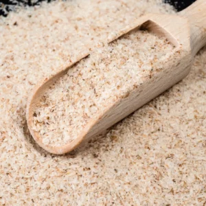 a wooden scooper full of Psyllium Husk