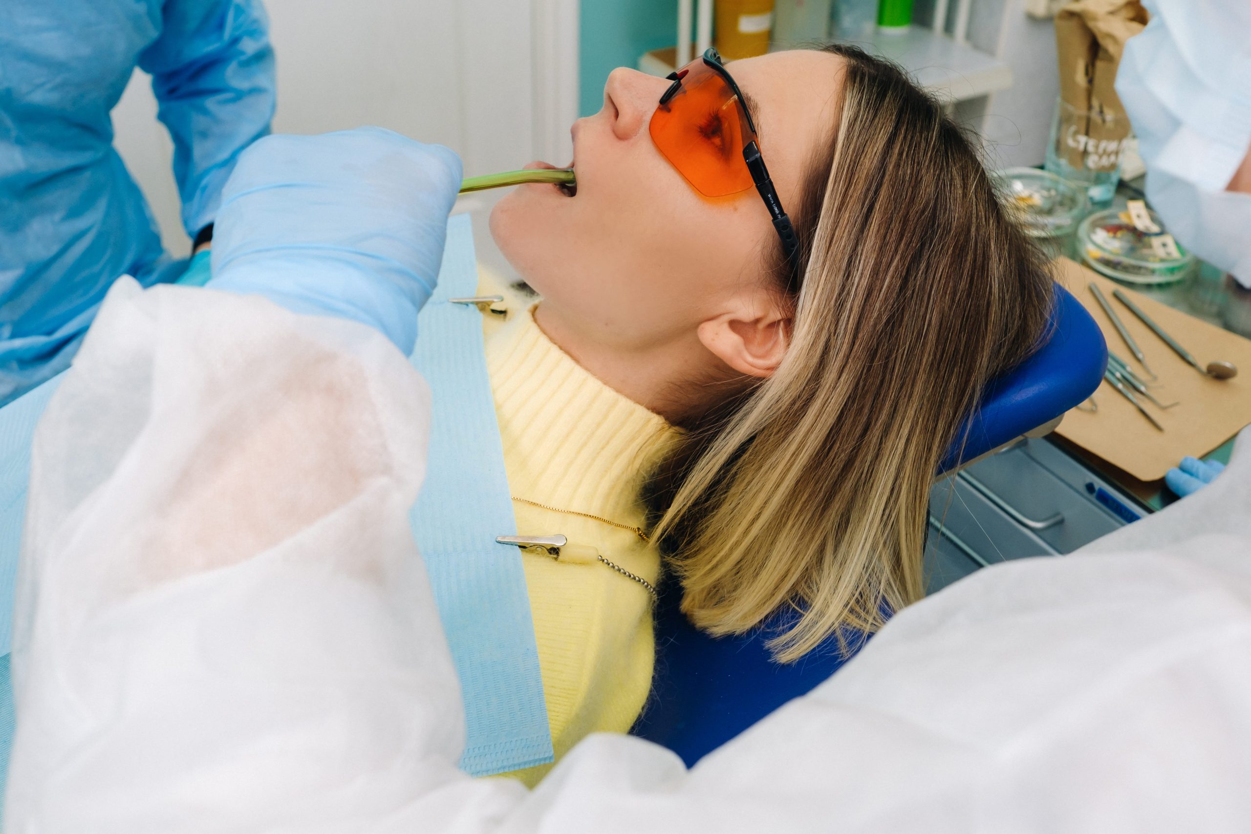young woman in dental glasses in the dental office