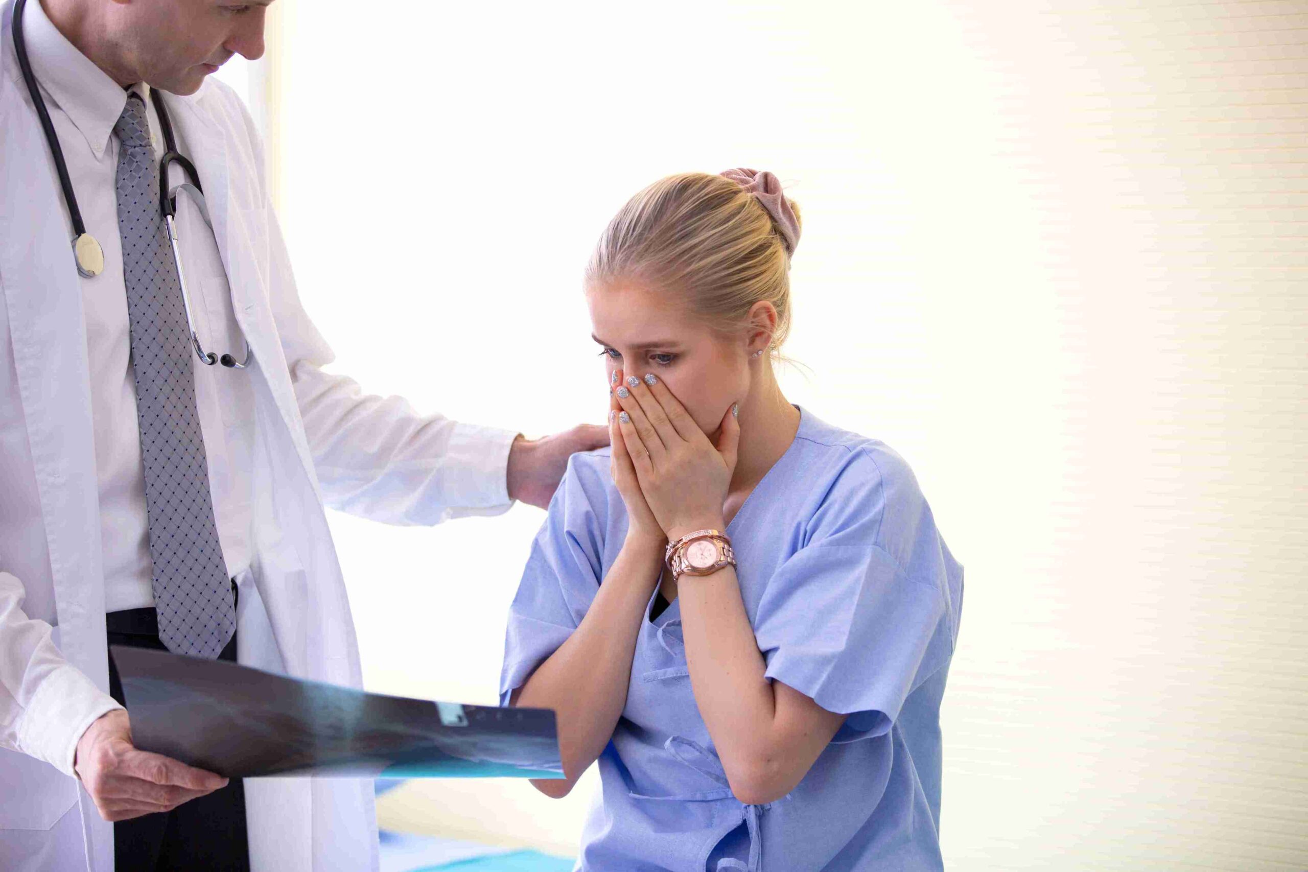 doctor comforting a shocked patient