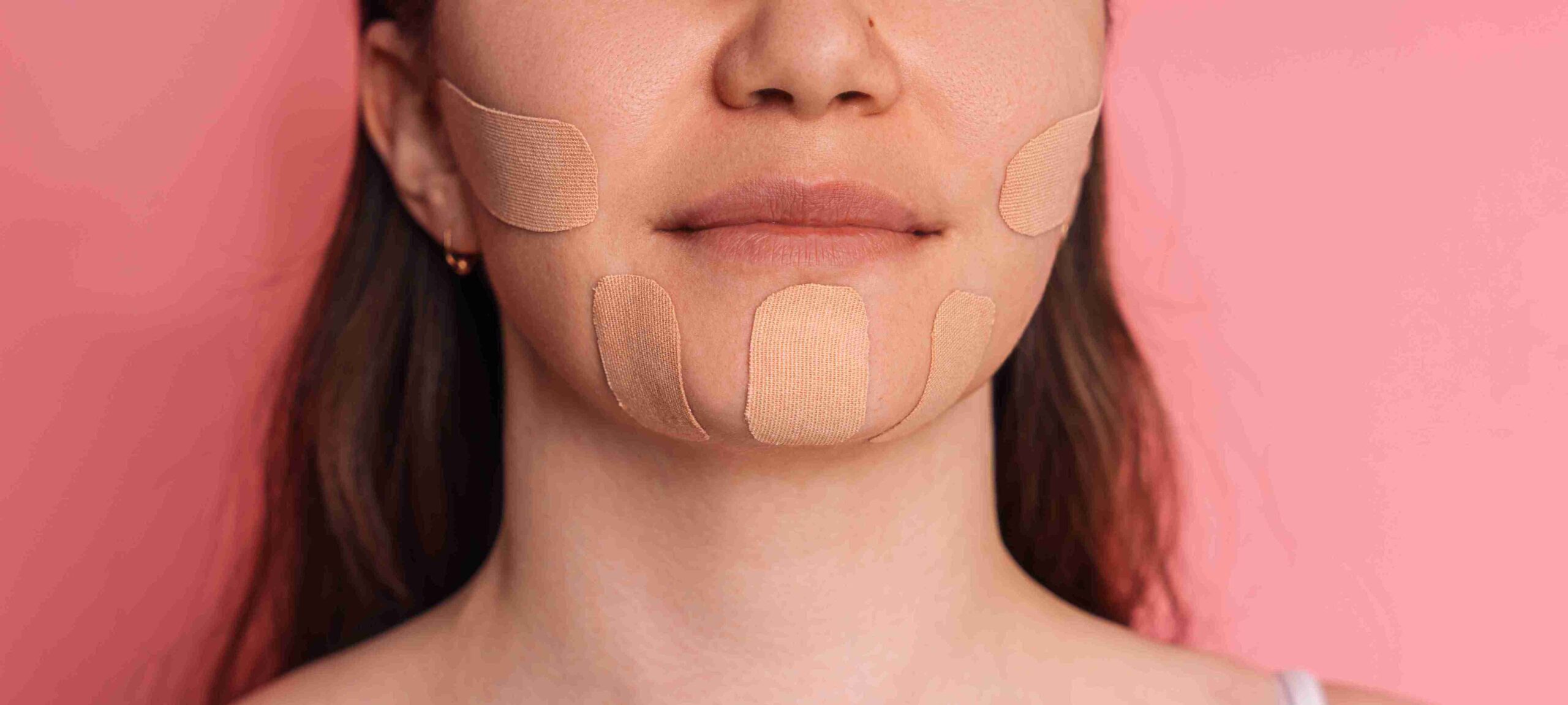 woman with tape pasted on her face