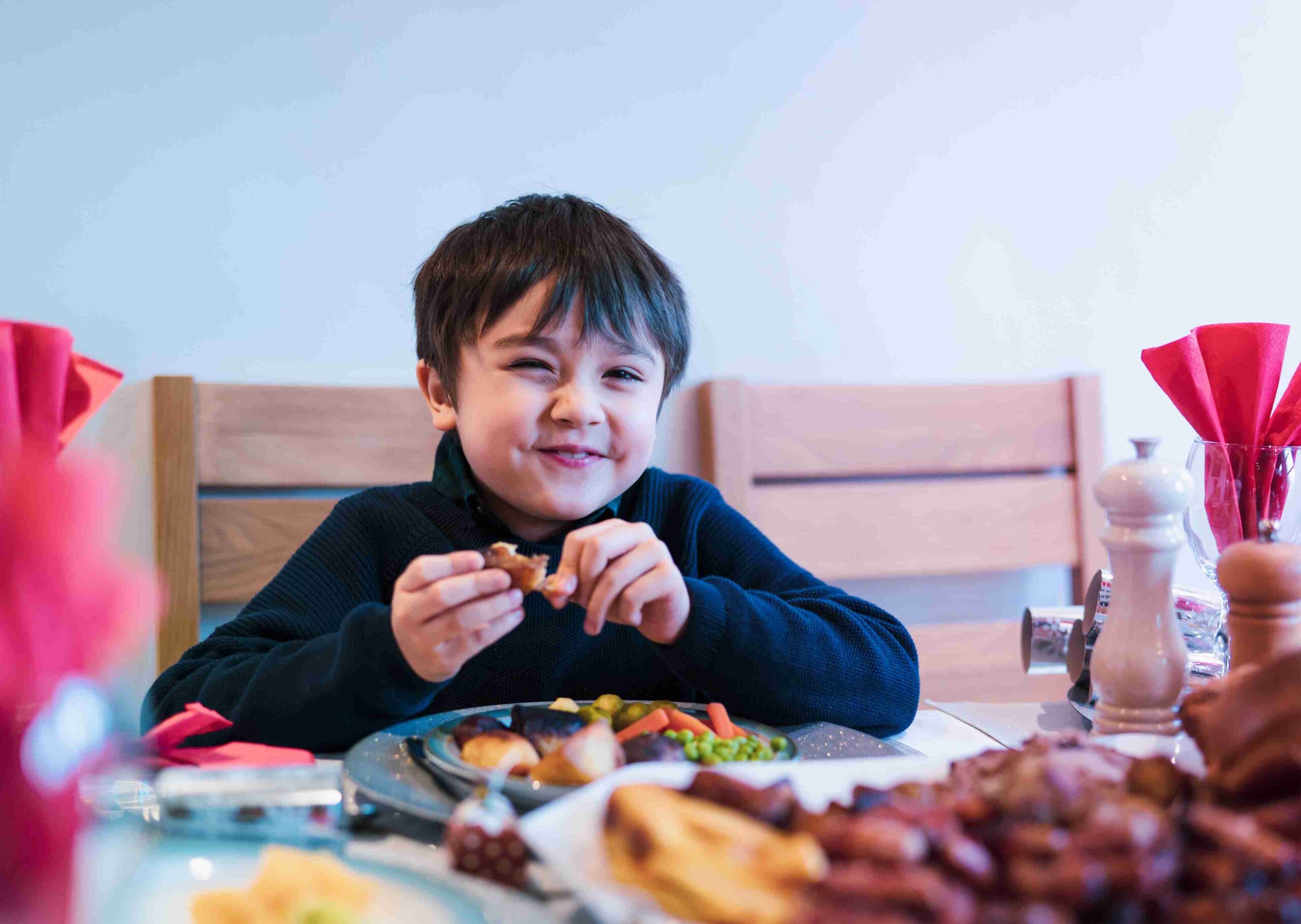 happy child smiling while eating