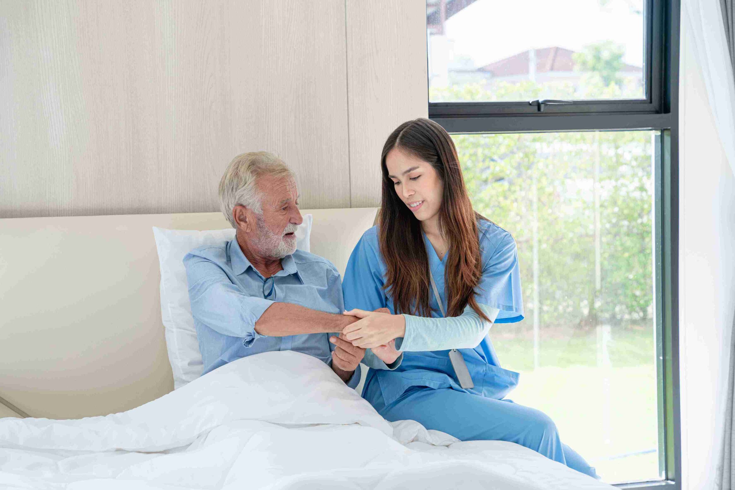 female caregiver assisting an elderly patient