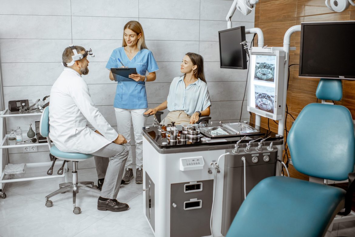 doctors and assistant talking to a female patient