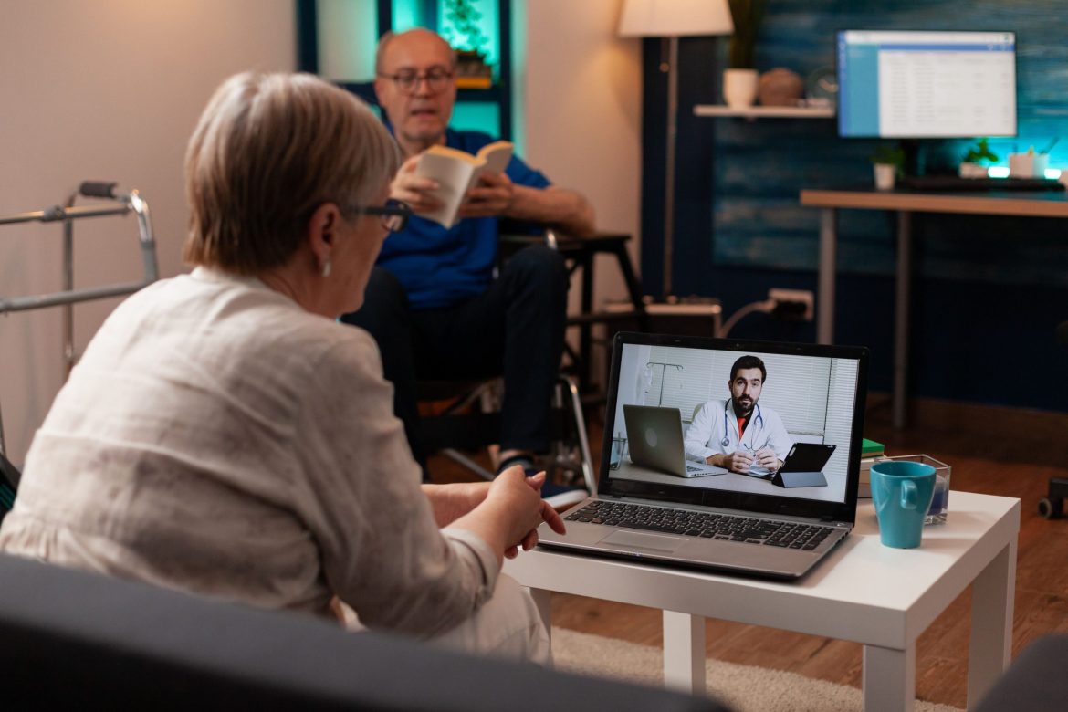 elderly patient on a video call with a doctor