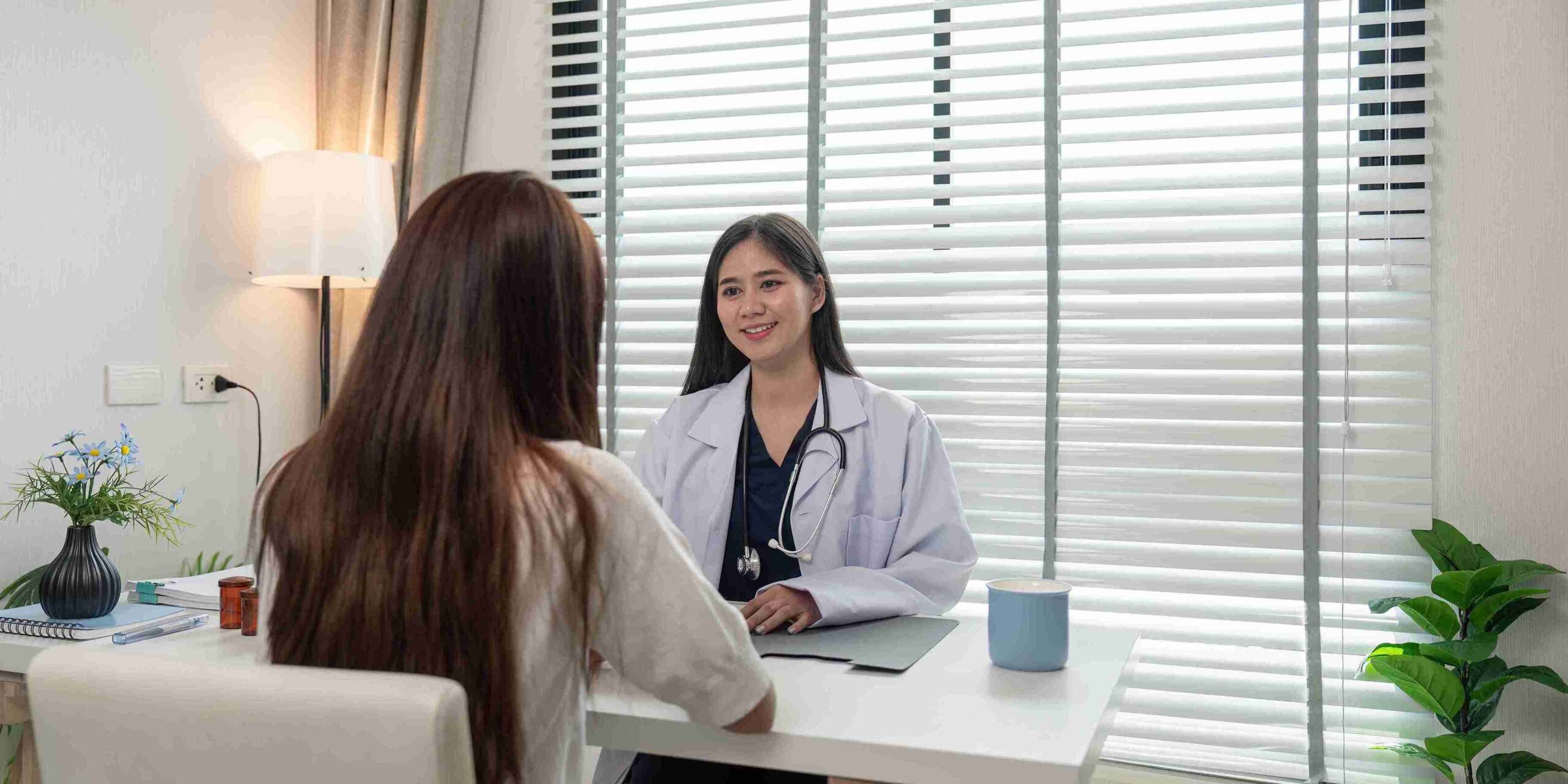 patient speaking with a female doctor