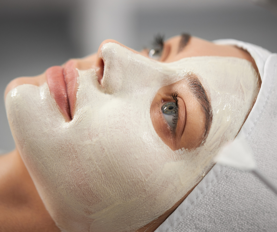 A woman relaxing with a white facial mask applied to her skin, highlighting deep hydration and nourishment