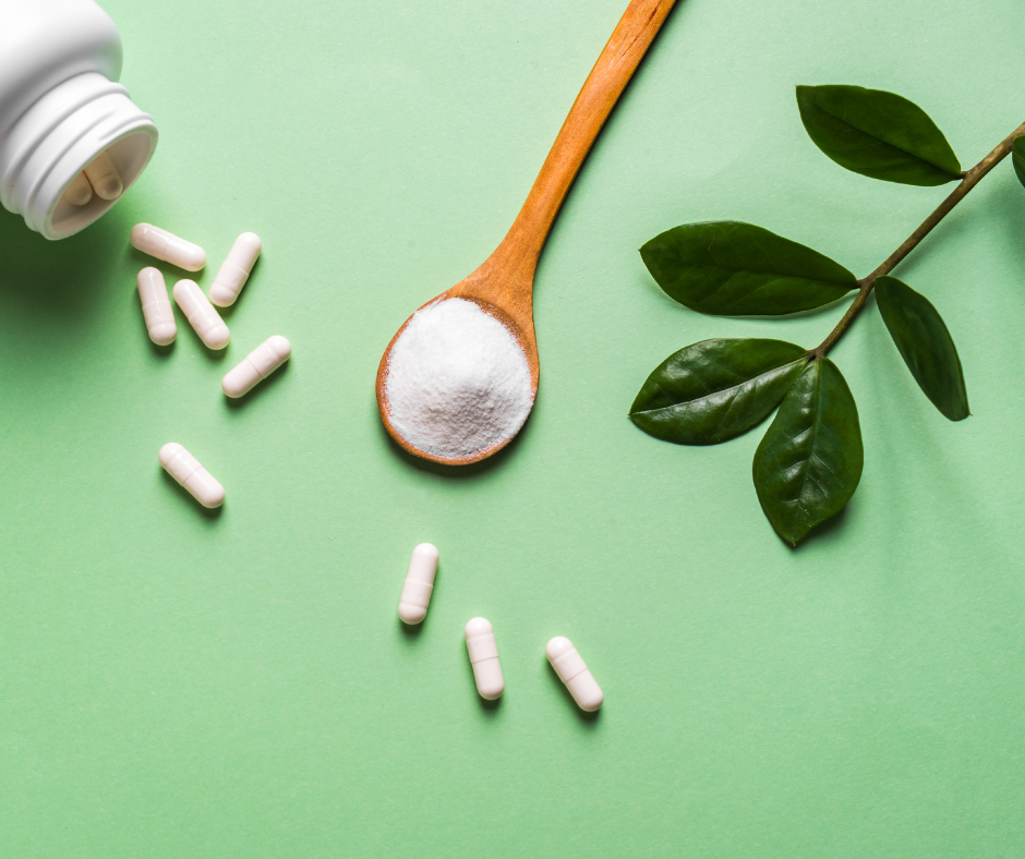White capsules and collagen powder displayed on green background