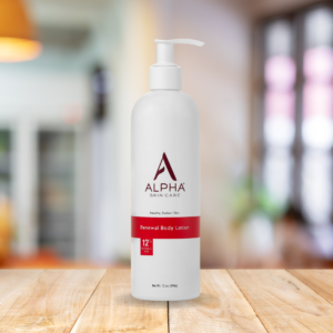 Alpha Skin Care Lotion Bottle on a wooden table and in a living room