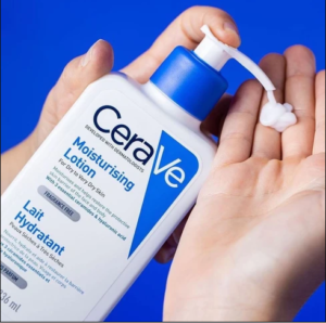 CeraVe Daily Moisturizing Lotion Product being pump on a hand from its bottle.