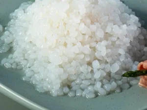 A plate of translucent sticky pearl rice with asparagus