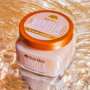Tree Hut Vanilla Shea Sugar Scrub tub on a reflective pinbk rose metallic surface