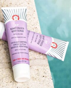 First Aid Beauty - KP Bump Eraser Body Scrub beside the swimming pool