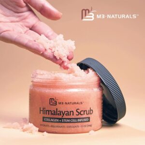 M3 Naturals Himalayan Salt Scrub being scooped by a hand from its tub
