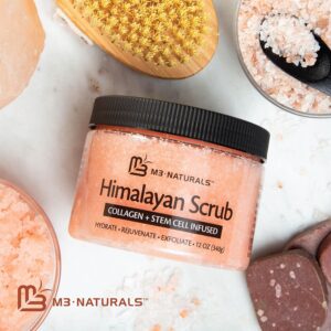 M3 Naturals Himalayan Salt Scrub surrounded by a srubber, himalayan salt, and other bath items