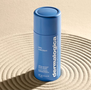 dermalogica bottle on sand