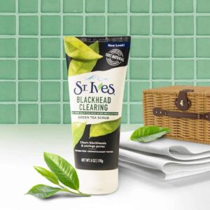 St Ives face scrub on a bathroom like setting with towels and a weaved basket