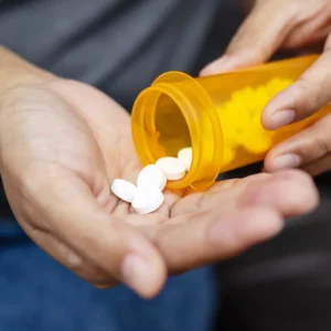 glutathione pills being taken from the bottle