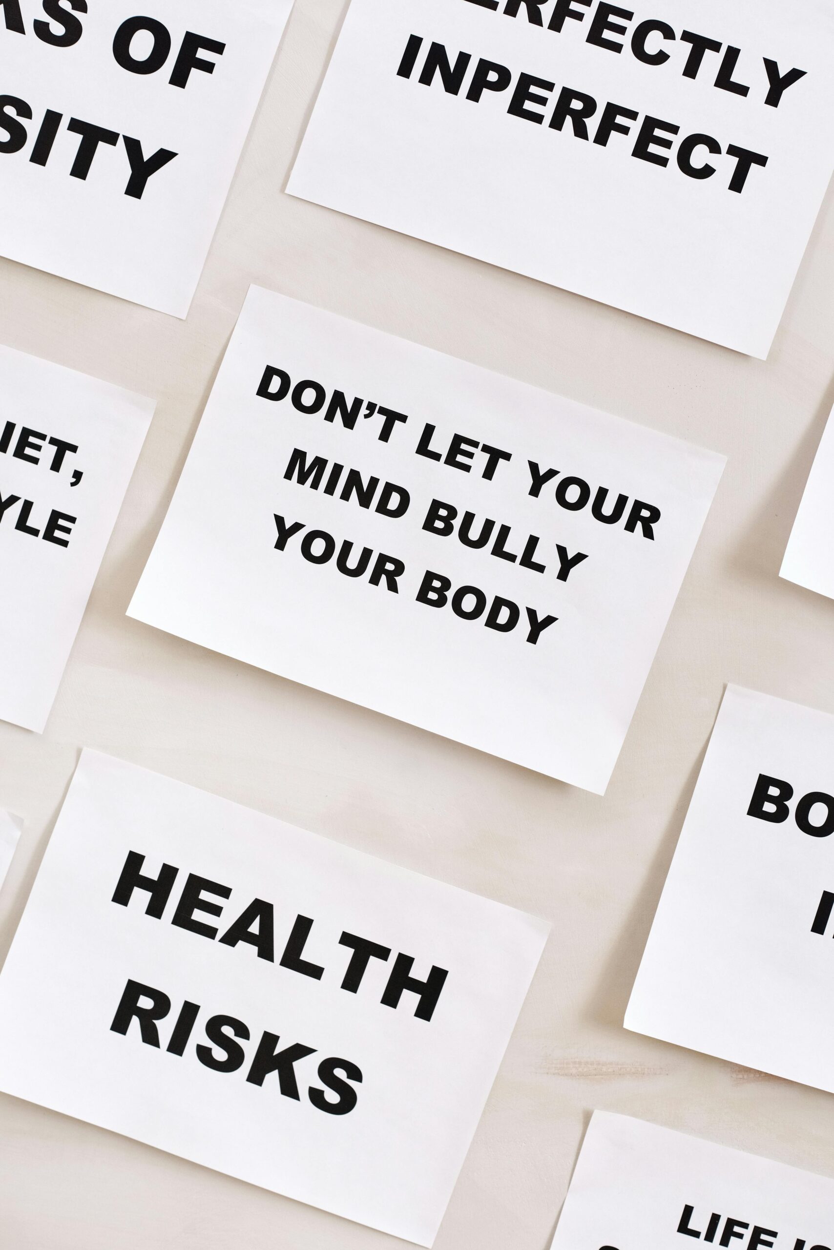 Words in Bold Letters Written on White Papers